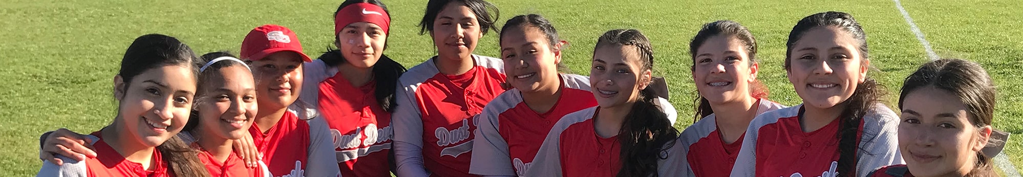 Group of happy athletes on the girls softball team