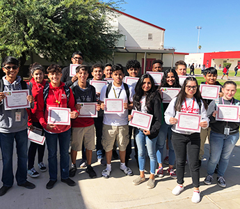 Group of students with award certificates