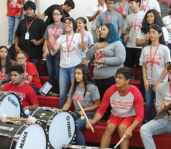 Spirited students in the gym during Homecoming Spirit Week