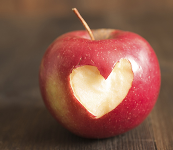 Apple with a heart-shaped bite