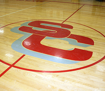 School basketball court with SC painted on the court