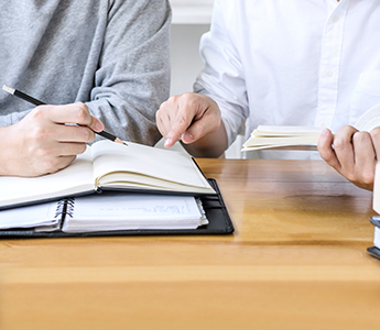 Teacher helping student with homework